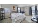 Comfortable bedroom featuring a ceiling fan, natural light, and neutral decor at 1717 Mill Creek Sw Ln, Concord, NC 28025