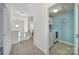 Upstairs hallway featuring a laundry area and a bathroom, creating a private area at 1717 Mill Creek Sw Ln, Concord, NC 28025