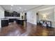 Modern kitchen features dark cabinets and stainless steel appliances at 1717 Mill Creek Sw Ln, Concord, NC 28025