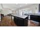 Modern kitchen seamlessly connected to the Gathering room creating a seamless living and entertaining space at 1717 Mill Creek Sw Ln, Concord, NC 28025