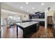 Open kitchen with dark cabinets and a large center island at 1717 Mill Creek Sw Ln, Concord, NC 28025