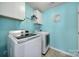 Bright laundry room with a washer, dryer, and ample storage space at 1717 Mill Creek Sw Ln, Concord, NC 28025