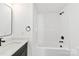 Bright bathroom featuring a white vanity with a granite countertop and a shower-tub combo at 2043 Greenoak Dr, Shelby, NC 28152
