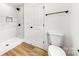 Bathroom featuring a shower with marble tile, wood laminate flooring and black hardware at 2043 Greenoak Dr, Shelby, NC 28152