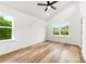 This bedroom has two windows, a ceiling fan, and wood laminate flooring at 2043 Greenoak Dr, Shelby, NC 28152