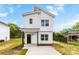 A charming two-story home featuring white siding and a covered front porch, set on a spacious lot at 2043 Greenoak Dr, Shelby, NC 28152