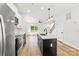 Bright kitchen with a center island, stainless steel appliances, white cabinets, and open floor plan at 2043 Greenoak Dr, Shelby, NC 28152