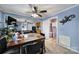 The dining room showcases a ceiling fan and leads to the kitchen, living room, and laundry room at 216 W 16Th St, Kannapolis, NC 28081