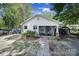 Charming single-story home with a screened-in porch and beautifully landscaped front yard at 216 W 16Th St, Kannapolis, NC 28081