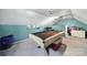 Spacious game room featuring a pool table, light colored carpet, blue walls, and ample space for entertainment at 216 W 16Th St, Kannapolis, NC 28081
