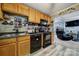 Functional kitchen featuring black appliances, warm wood cabinets, and durable countertops at 216 W 16Th St, Kannapolis, NC 28081