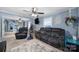 Comfortable living room featuring a plush sofa, ceiling fan, and cozy decor at 216 W 16Th St, Kannapolis, NC 28081