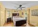 Bedroom with hardwood floors, ceiling fan, and natural light from two windows at 2234 Hamilton Mill Rd, Charlotte, NC 28270