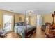 Traditional bedroom with a four-poster bed and hardwood floors at 2234 Hamilton Mill Rd, Charlotte, NC 28270