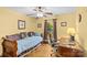 Bedroom featuring hardwood floors, ceiling fan, and large window at 2234 Hamilton Mill Rd, Charlotte, NC 28270