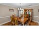Traditional dining room with hardwood floors, a wooden table, and elegant furnishings at 2234 Hamilton Mill Rd, Charlotte, NC 28270