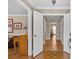 Inviting foyer featuring hardwood floors, light-colored walls, and an open doorway at 2234 Hamilton Mill Rd, Charlotte, NC 28270