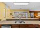 Kitchen featuring stone countertops, stainless steel appliances and a view to the patio at 2234 Hamilton Mill Rd, Charlotte, NC 28270