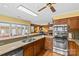Traditional kitchen with stainless steel appliances, wood cabinets and view to living area at 2234 Hamilton Mill Rd, Charlotte, NC 28270