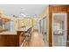 Large kitchen with breakfast bar, wood floors and lots of light from the sliding glass doors at 2234 Hamilton Mill Rd, Charlotte, NC 28270