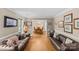 Bright living room with hardwood floors, neutral walls, and elegant decor leading into dining room at 2234 Hamilton Mill Rd, Charlotte, NC 28270