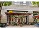 Exterior view of Rhino Market & Deli showcasing its entrance, signage, and outdoor seating area at 2234 Hamilton Mill Rd, Charlotte, NC 28270