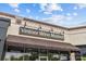 The Vintner Wine Market exterior boasts inviting signage, offering a glimpse of the 'Kitchen' and 'Wine Bar' at 2234 Hamilton Mill Rd, Charlotte, NC 28270