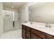 Bright bathroom with double vanity and glass-enclosed shower at 226 Scenic View Ln, Matthews, NC 28104