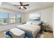 Inviting bedroom with tray ceiling, plush carpet, and plenty of natural light from the windows at 226 Scenic View Ln, Matthews, NC 28104