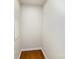 A small closet with neutral walls and hardwood flooring, offering a compact storage solution at 226 Scenic View Ln, Matthews, NC 28104