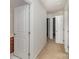 Bright hallway with multiple white doors, creating a clean and accessible transition between rooms at 226 Scenic View Ln, Matthews, NC 28104