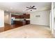Spacious living room and kitchen combo, featuring dark wood cabinets, stainless steel appliances, and ample light at 226 Scenic View Ln, Matthews, NC 28104