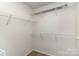 Bright walk-in closet featuring white wire shelving, offering ample storage and organization solutions at 226 Scenic View Ln, Matthews, NC 28104