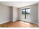 Bright bedroom featuring hardwood floors, a large window providing natural light, and neutral paint at 2596 Polo Ln, Maiden, NC 28650