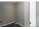 Functional laundry room with tile flooring, utility connections, and convenient access to storage space at 2596 Polo Ln, Maiden, NC 28650