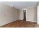 Spacious living room with hardwood floors and neutral wall colors at 2596 Polo Ln, Maiden, NC 28650