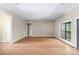 Spacious living room with hardwood floors, neutral walls, bright windows, and access to other rooms at 2596 Polo Ln, Maiden, NC 28650