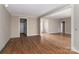 Open-concept living room with hardwood floors and ample space for entertaining at 2596 Polo Ln, Maiden, NC 28650