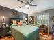 Comfortable bedroom featuring a queen-sized bed, stylish decor, and a bright window desk area at 2620 Park Rd, Charlotte, NC 28209