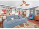 Spacious living room with comfortable seating, built-in shelving, and ceiling fan provides ample room for relaxation and entertainment at 2620 Park Rd, Charlotte, NC 28209