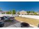 A backyard has a patio area, furniture, grass, and a fire pit perfect for relaxation and entertaining at 269 Keating Place Dr, Fort Mill, SC 29708