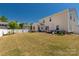Spacious backyard featuring a patio area, new fence and lush lawn perfect for entertaining at 269 Keating Place Dr, Fort Mill, SC 29708