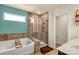 A luxurious bathroom features a tub, glass shower, and large window at 269 Keating Place Dr, Fort Mill, SC 29708