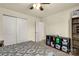 Comfortable bedroom with patterned bedspread, closet, and shelving for storage and easy organization at 269 Keating Place Dr, Fort Mill, SC 29708