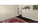 Simple room with a striking rug, white door, and a decorative shelf at 269 Keating Place Dr, Fort Mill, SC 29708