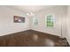 Bright dining room features hardwood floors, windows, and a decorative chandelier at 269 Keating Place Dr, Fort Mill, SC 29708