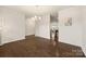 Empty dining space with modern chandelier and access to kitchen and living areas at 269 Keating Place Dr, Fort Mill, SC 29708