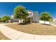 Well maintained yard with mature shade trees surrounding the home on a clear day at 269 Keating Place Dr, Fort Mill, SC 29708