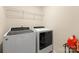 Modern laundry room featuring new front load washer and dryer at 269 Keating Place Dr, Fort Mill, SC 29708