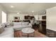 Open-concept living area with a comfortable sofa, adjacent to the dining and kitchen spaces at 269 Keating Place Dr, Fort Mill, SC 29708
